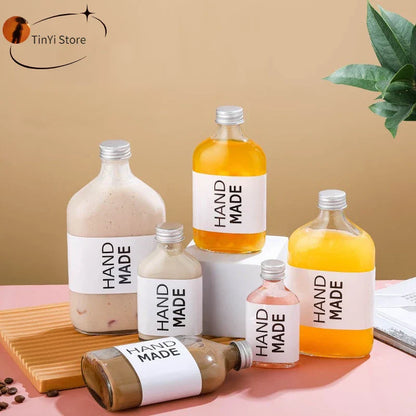 DecorBites™ Clear Glass Beverage Bottles: Reusable for Juicing, Smoothies, Kombucha, Tea, Milk, and Wine