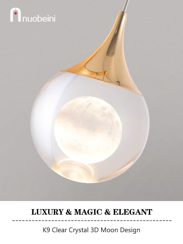 a modern luxurious crystal led wall sconce featuring a sleek gold-toned curved lamp and a clear crystal globe with an illuminated 3d moon design for bedroom use