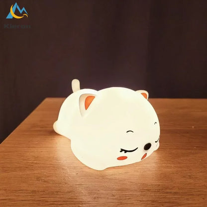 Luz nocturna LED de silicona con forma de gato DecorBites™ con control remoto