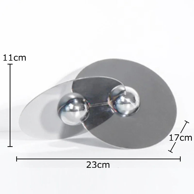 Escultura geométrica circular DecorBites™: Adorno moderno de metal para escritorio que aporta un toque estético a la habitación.