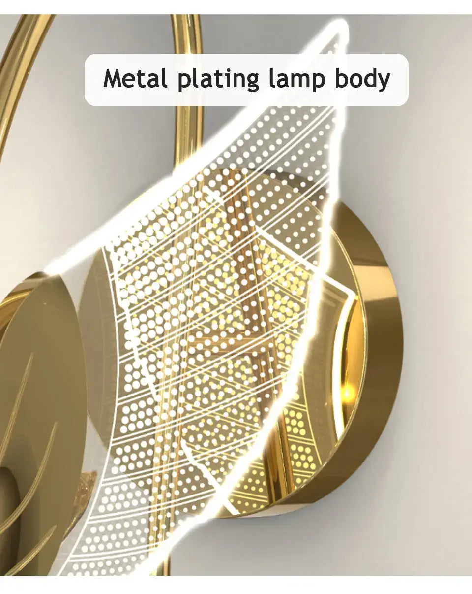 Art deco gold swan wall lamp with a gold-plated metal body featuring intricate perforations and curved elements designed for use as a bedroom bedside wall lamp.