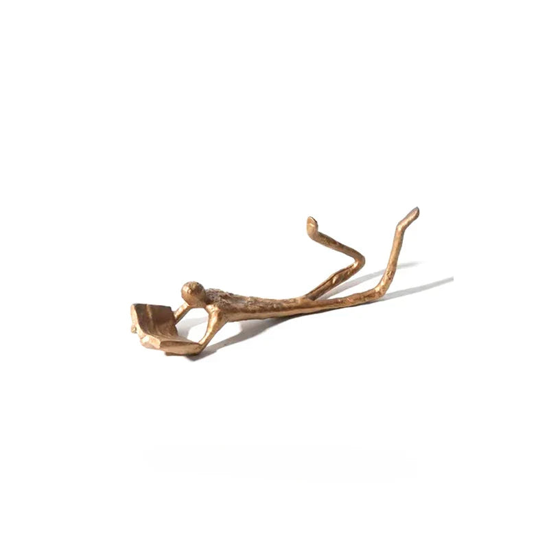 Gold Reader Sculpture