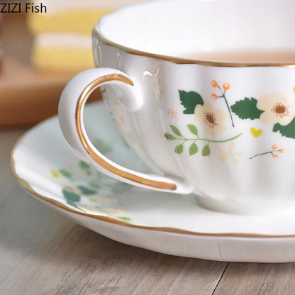 DecorBites™ Elegant Gold Flower Cup & Saucer Set - Delicate Porcelain Tea Coffee Mug