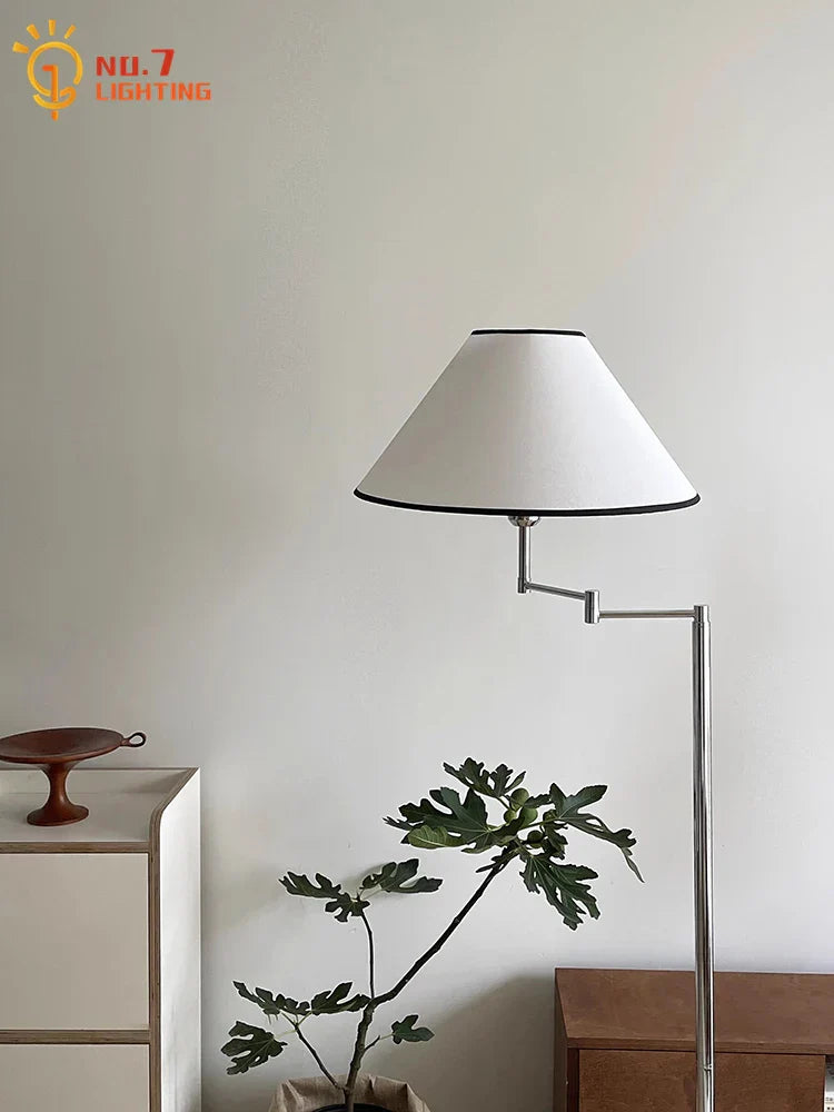 Lámpara de pie LED DecorBites™ color crema con brazo oscilante para espacios de vida modernos