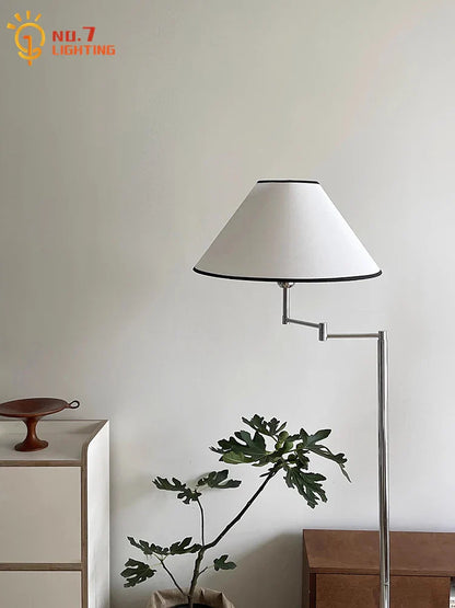 Lámpara de pie LED DecorBites™ color crema con brazo oscilante para espacios de vida modernos