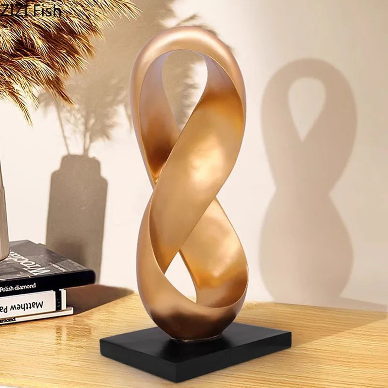 Adorno de escritorio DecorBites™ con escultura de nudo dorado. Decoración minimalista y abstracta para habitaciones.