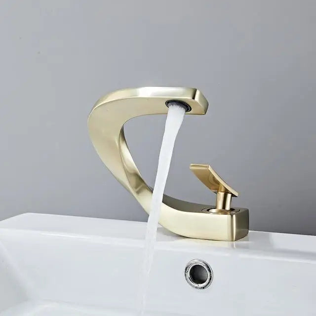 Grifo mezclador para lavabo DecorBites™ negro, acabado dorado cepillado, para baño, agua fría y caliente, cromado.
