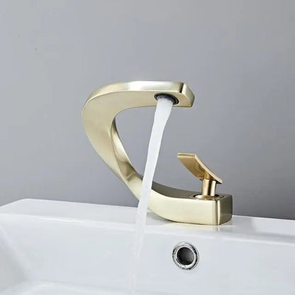 Grifo mezclador para lavabo DecorBites™ negro, acabado dorado cepillado, para baño, agua fría y caliente, cromado.