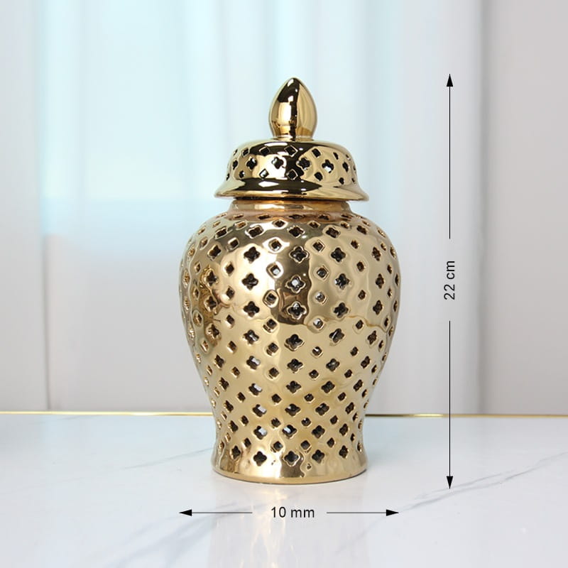 DecorBites gold ceramic carved temple jar with intricate diamond-shaped cutouts and matching lid measuring 22 cm tall for elegant home decor.