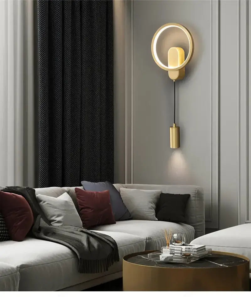 Gold-toned circular modern nordic led wall lamp with a sleek black gold finish and an illuminated ring for bedroom use.