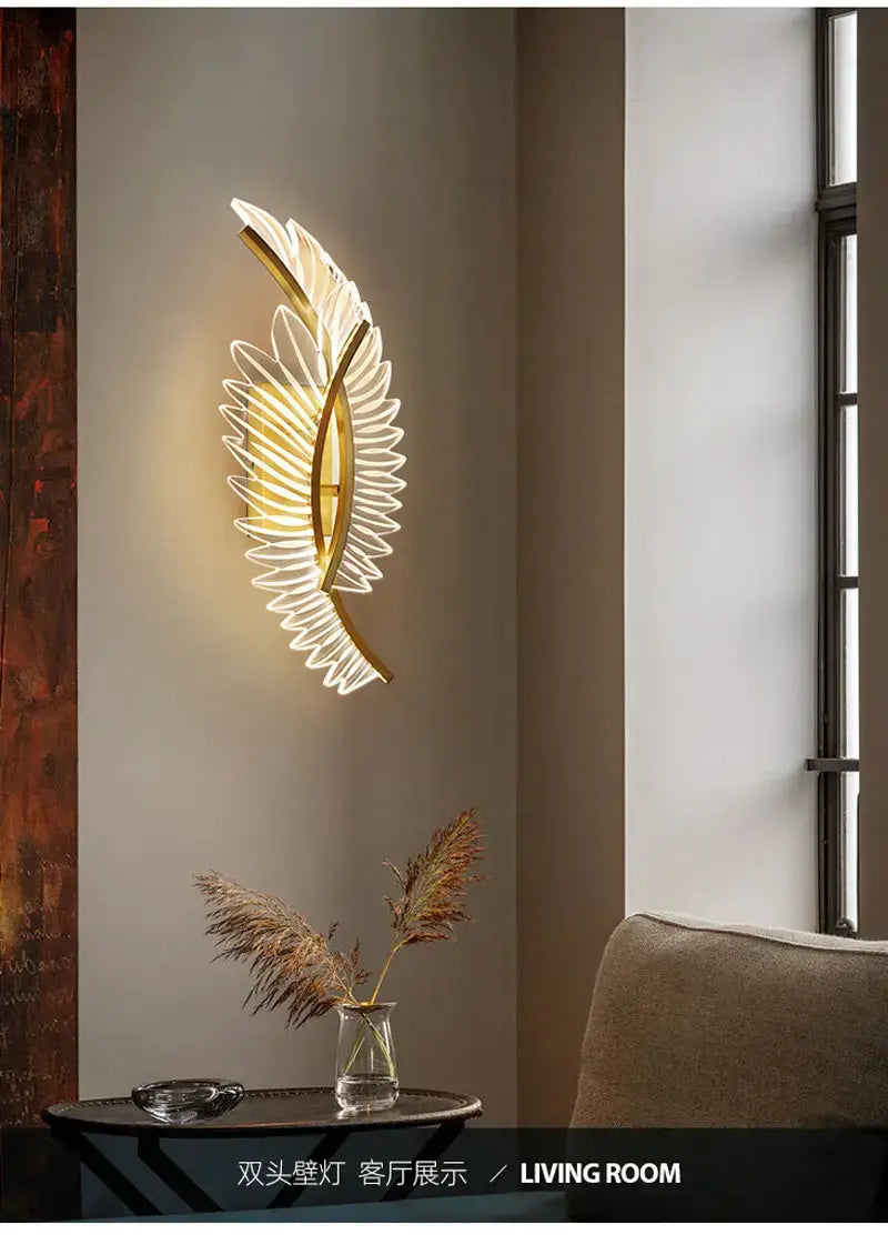 nordic modern art gold feather wall lamp with illuminated translucent wing-like panels designed as a wall lamp for bedroom use.