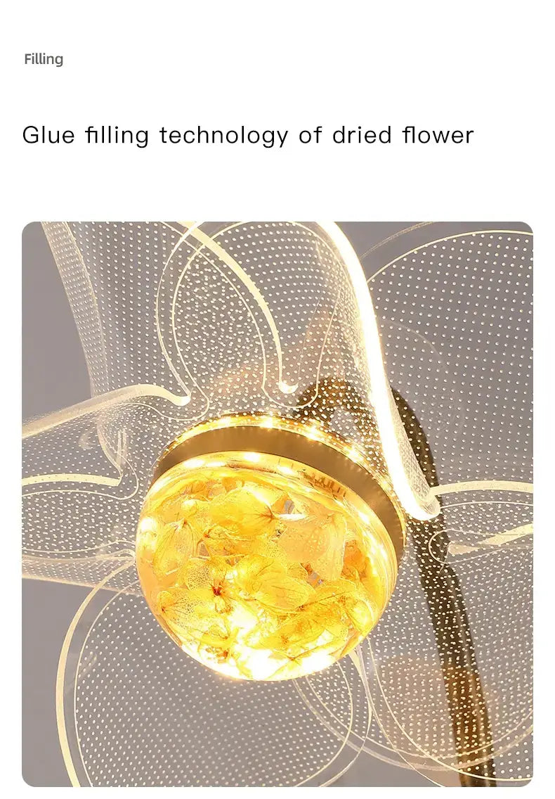 Creative floral decorative gold led wall lamp featuring a golden spherical pendant with embedded dried yellow flowers sealed with glue filling technology for bedroom use.