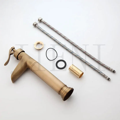 Grifo mezclador giratorio para baño DecorBites™ de latón antiguo con un solo mando