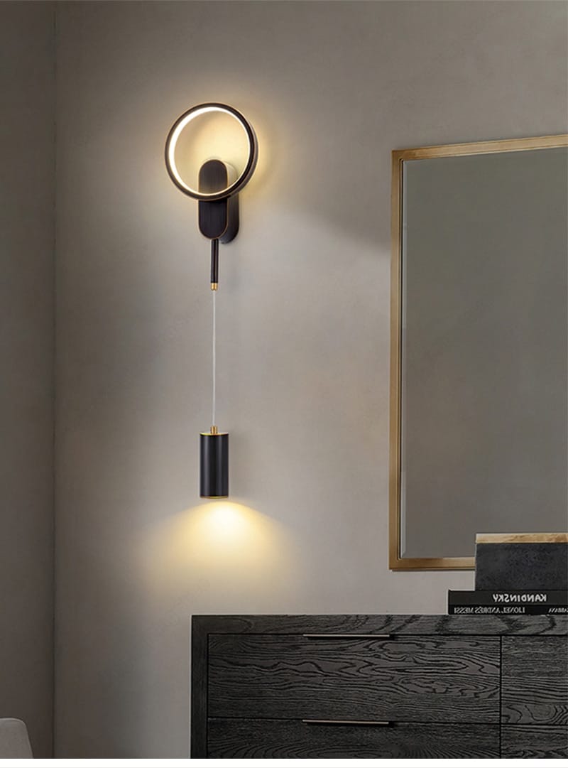 Modern nordic led wall lamp bedroom sconce in black and gold featuring a circular wall mount with a hanging cylindrical light fixture.
