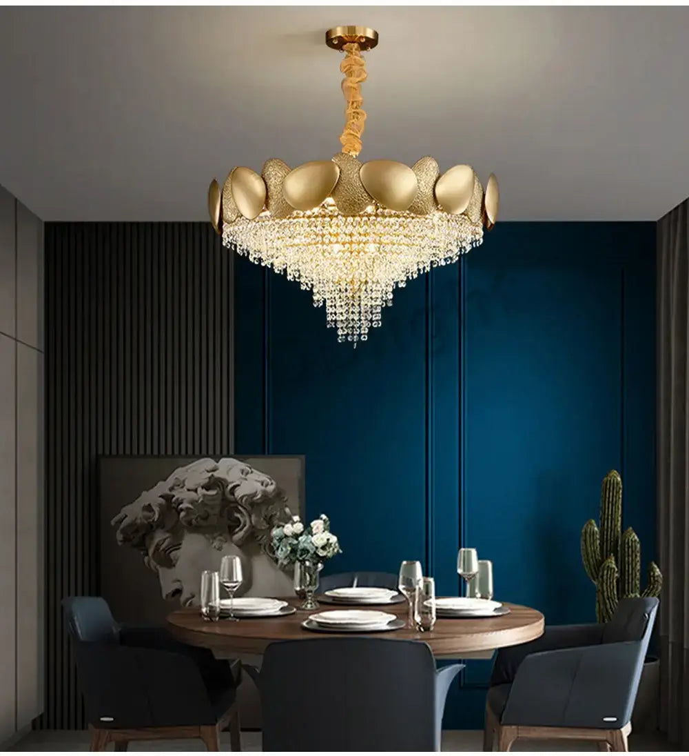 Luxury gold led ceiling chandelier featuring a shell-shaped design with cascading crystal droplets for living room decor.