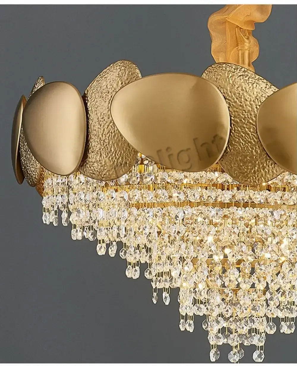 Luxury gold crystal led ceiling chandelier featuring textured oval-shaped plates and cascading crystal droplets for living room elegance.