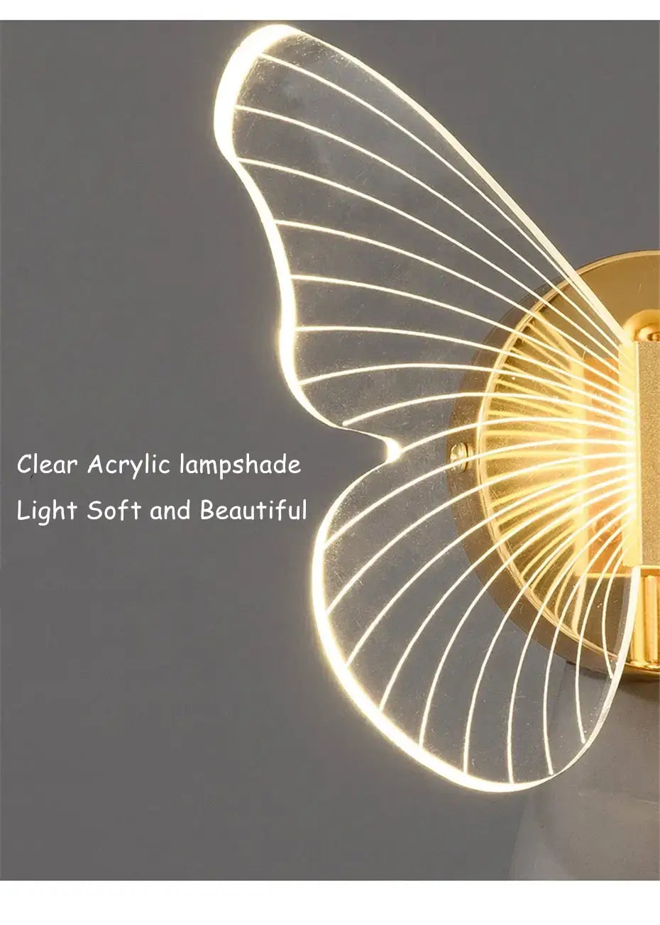 Art deco gold swan bedroom bedside wall lamp with clear acrylic butterfly-shaped design crystal and internal led lighting.
