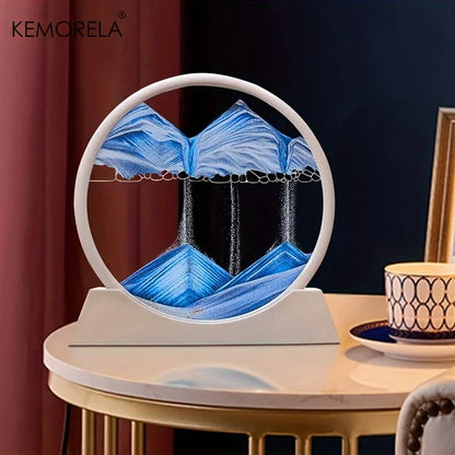 لوحة فنية ثلاثية الأبعاد من ديكوربايتس™ للرمال المتحركة - ساعة رملية دائرية زجاجية بمنظر محيطي رملي، مقاس 12 بوصة