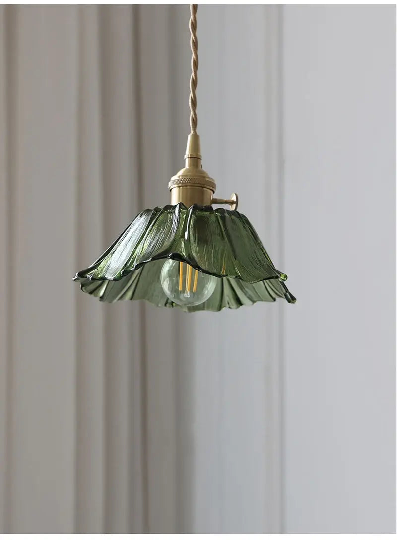 A delicate green flower glass pendant light with a fluted petal-like design and brass hardware, ideal for dining room home decor and pendant lights.