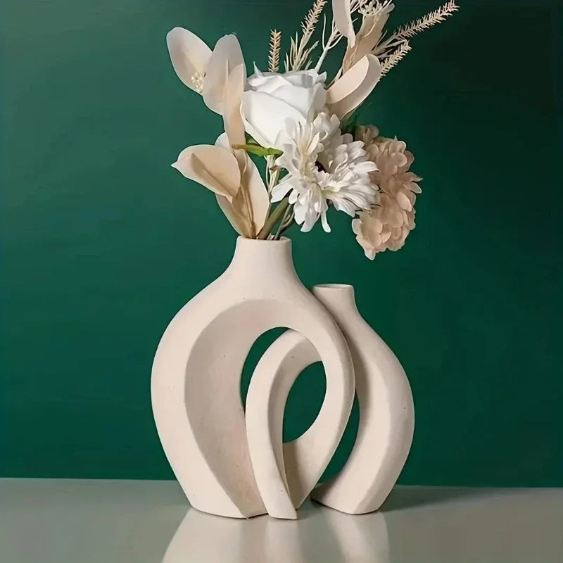 Cream-colored ceramic hollow vase with modern abstract curved forms in a set of 2 for living room decor from mainland china