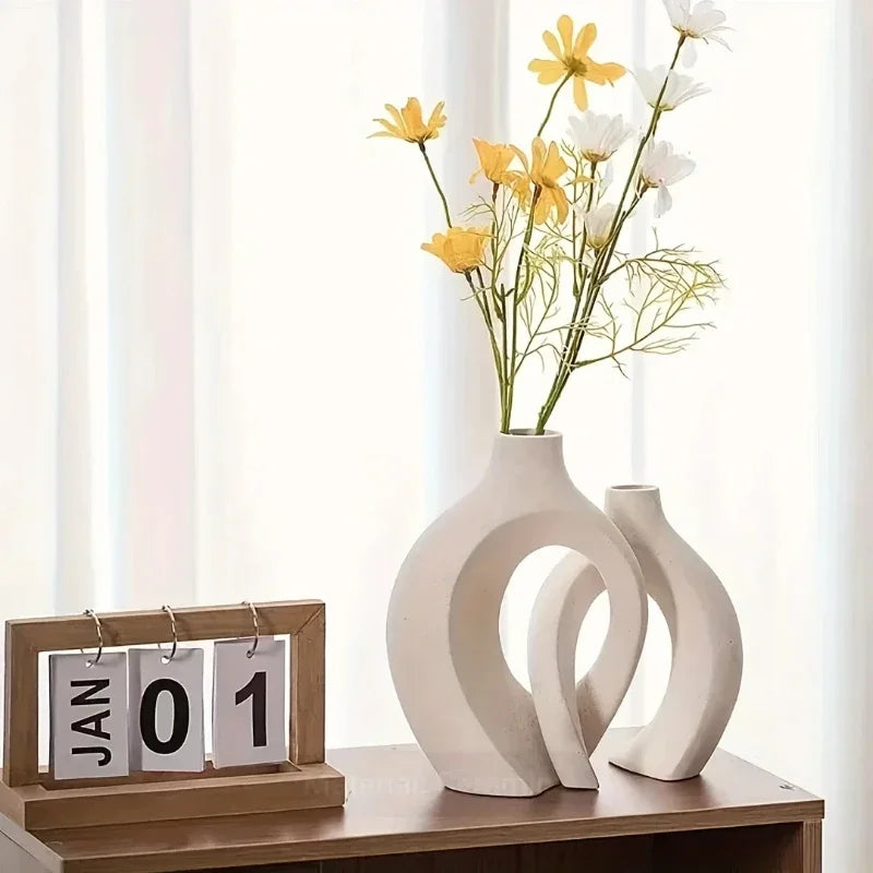 White ceramic vase with modern abstract interlocking curves made in mainland china for living room decor