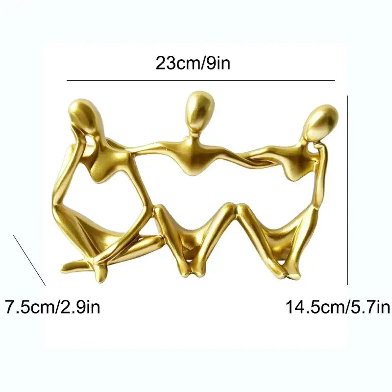 Golden metallic abstract friendship figurine of three human figures holding hands for living room decor