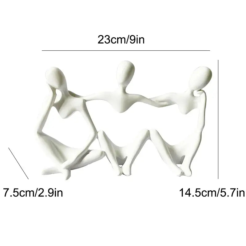 White ceramic abstract friendship figurine depicting three connected seated figures for living room decor