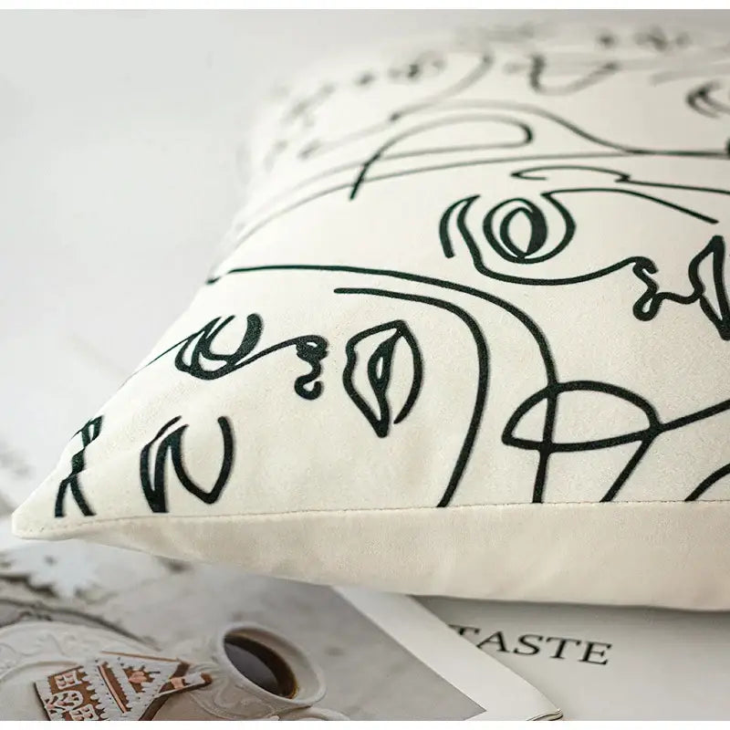 Cream-colored beige textured pillow cover with black line-art abstract face design for living room decorbites accents