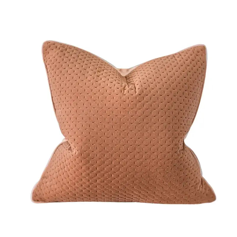 A dusty rose velvet pillow cover with subtle quilted texture complements decorbites beige textured pillow decor