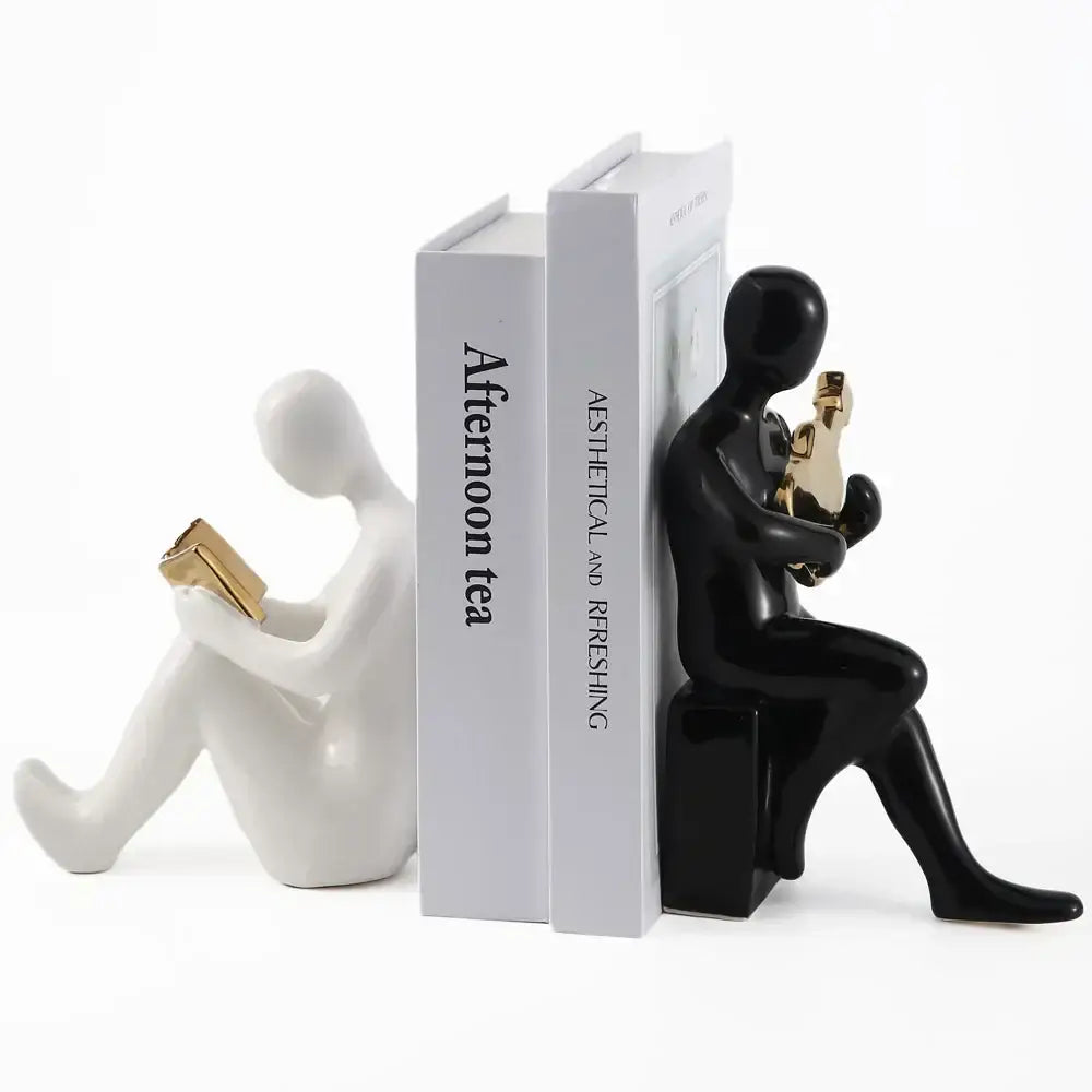 Black and white ceramic character bookends with gold detail in abstract nordic style for office decorbites guitar decor