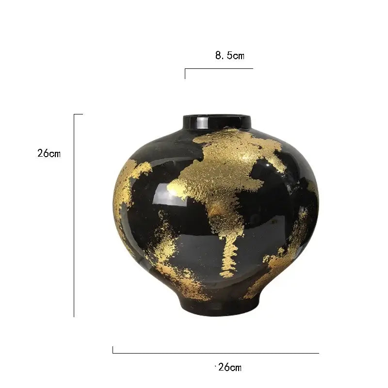 Black ceramic vase with gold foil pattern accents ideal for abstract living room decor