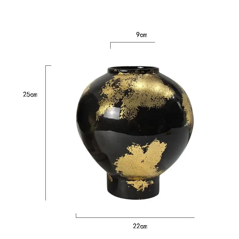 A glossy black ceramic vase with gold foil pattern accents measuring 25cm for living room decor