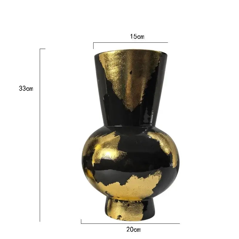 A sleek black ceramic vase with an elegant gold foil pattern and glossy finish for living room decor