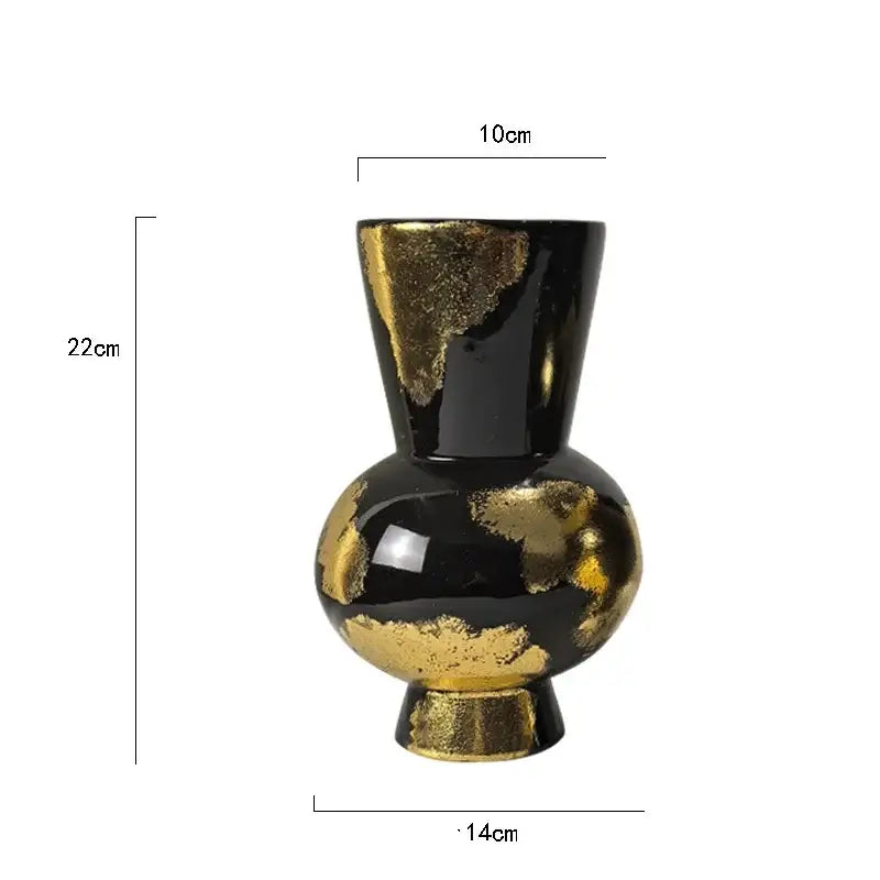 Black ceramic vase with gold foil pattern accents ideal for living room decor and abstract design