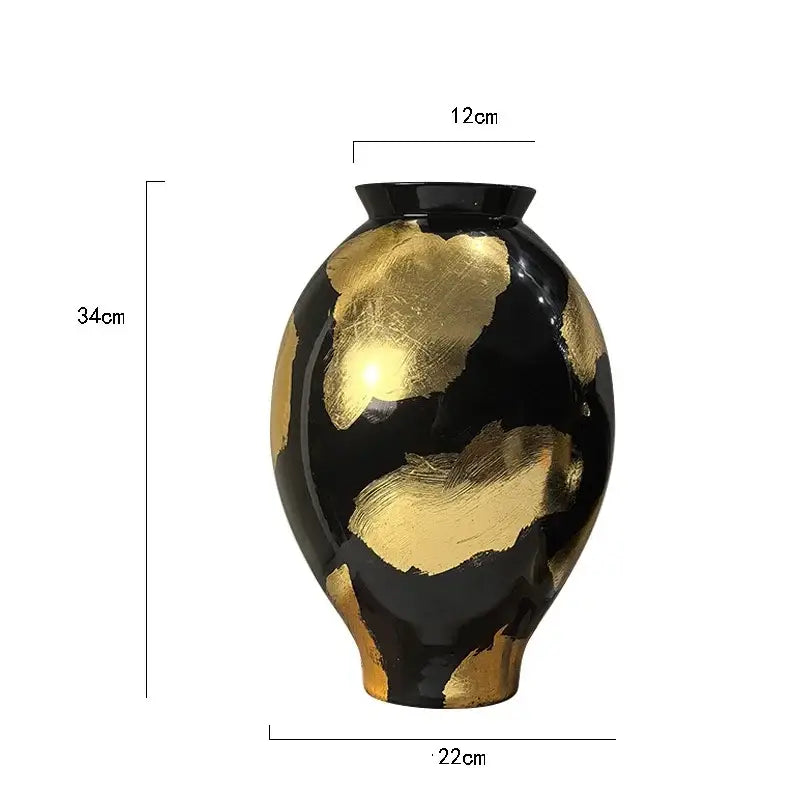Elegant black ceramic vase with bold hand-painted gold foil pattern in swirling designs for living room decor