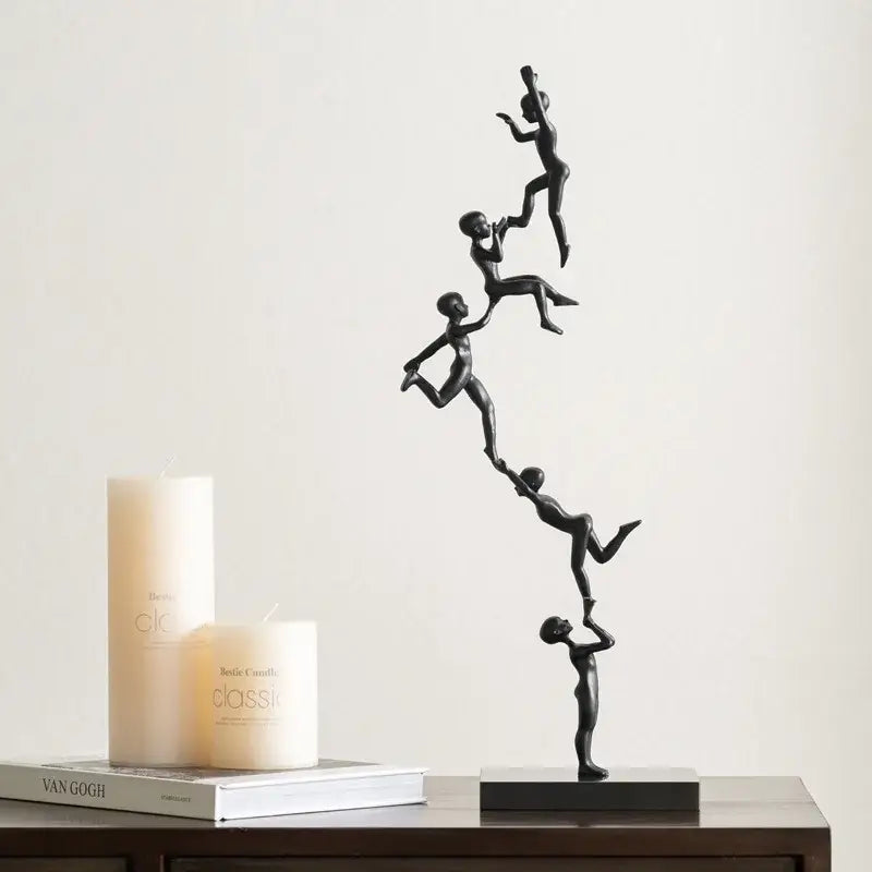 Abstract black and silver human figure sculpture featuring matte finish and dynamic acrobatics poses for living room decorbites decor
