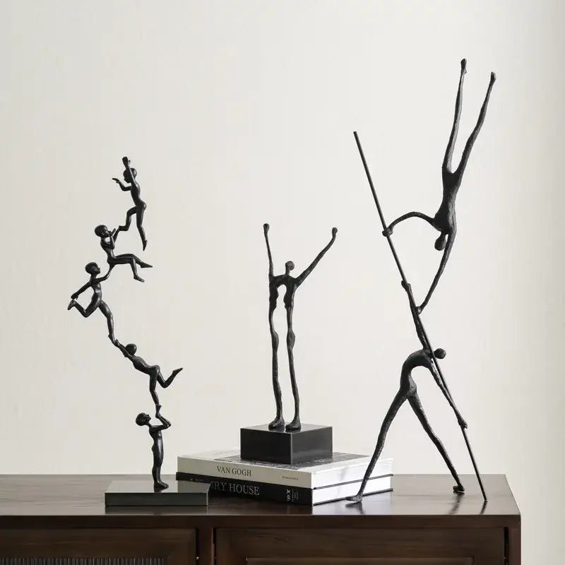 Abstract black and silver human figure sculpture with elongated forms and smooth metallic finish for living room decorbites decor