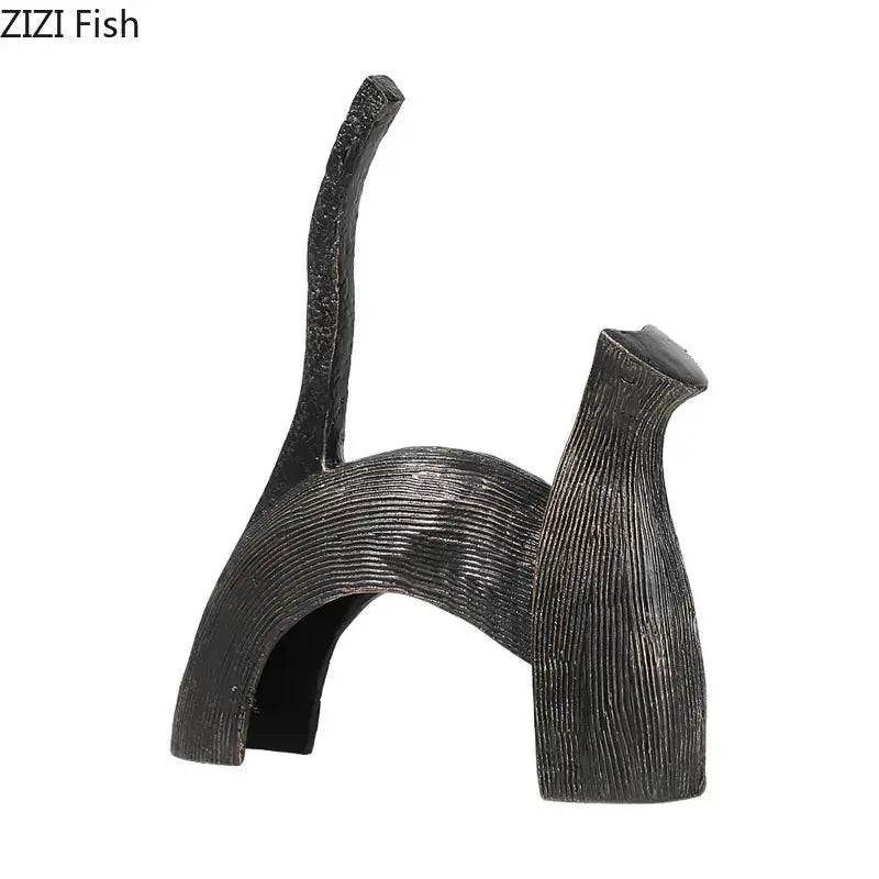 Black textured cat figurine with sleek minimalist design and arched back complementing decorbites bull statue decor