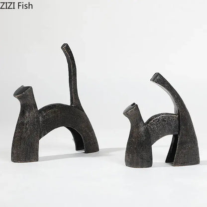 Two abstract black cast iron cat figurines with textured ribbed surfaces for decorbites bull statue living room decor