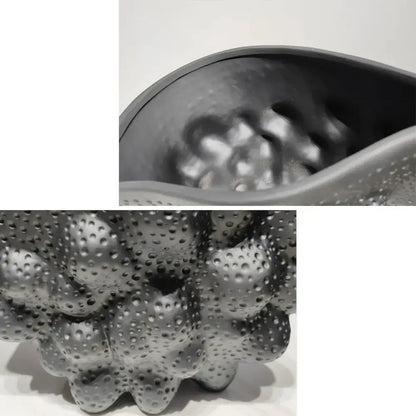 Gray silicone massage ball with textured bumpy surface and raised dots paired with decorbites black ceramic pleated vase