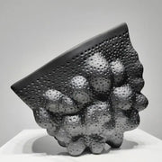 Abstract black ceramic pleated vase with textured bubble-like protrusions for living room decorbites black ceramic sculpture