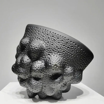 Matte black ceramic pleated vase with textured raised bumps and embedded dots for modern decorbites black ceramic decor