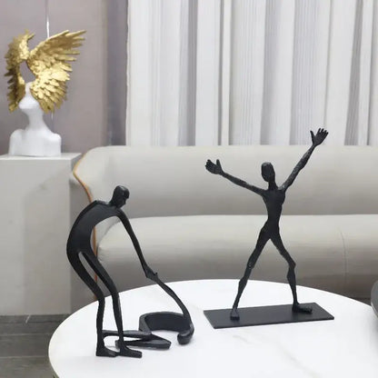 Abstract black geometric couple cast iron sculpture with elongated limbs on rectangular base for home decor by decorbites