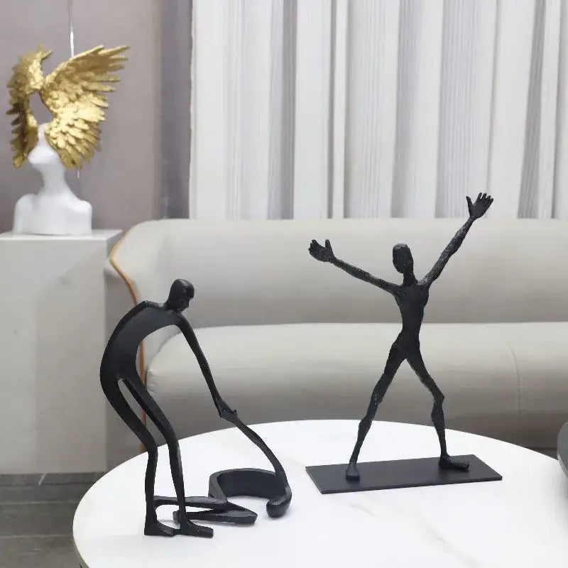 Abstract black geometric couple cast iron sculpture with elongated limbs on rectangular base for home decor by decorbites