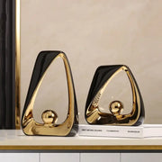 Abstract black and gold ceramic geometric triangles sculpture with glossy finish for elegant living room home decor