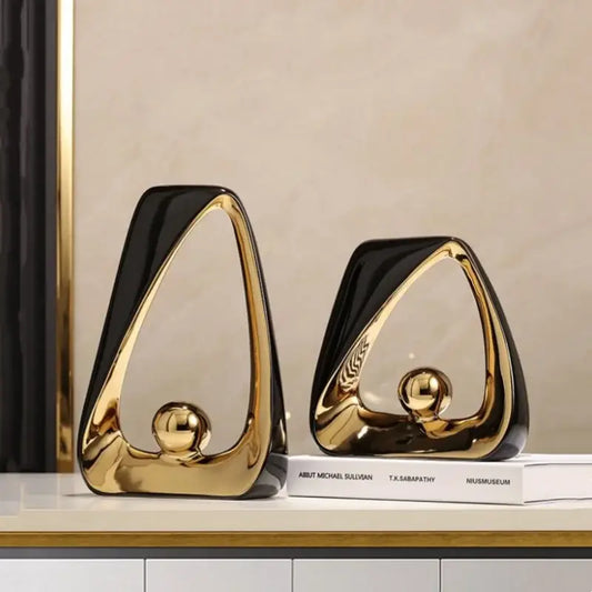 Abstract black and gold ceramic geometric triangles sculpture with glossy finish for elegant living room home decor