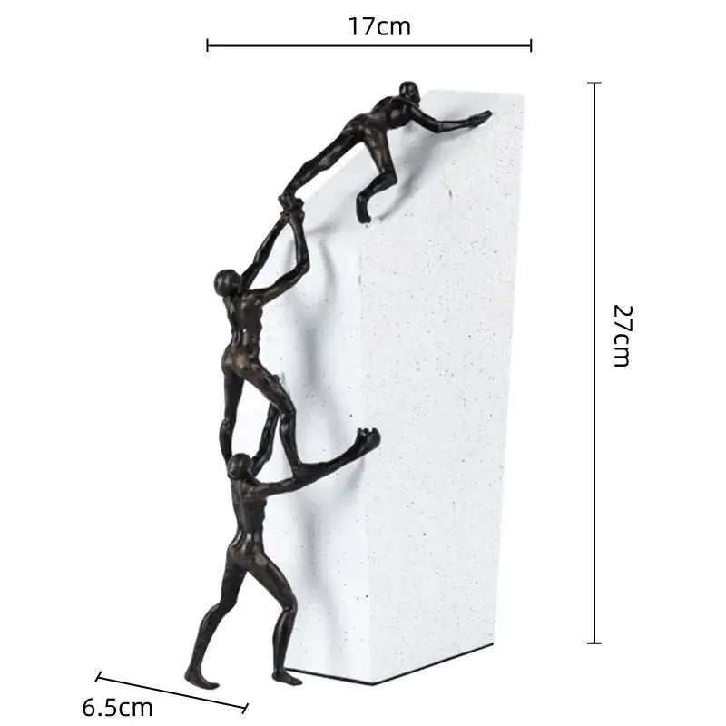 Abstract black and gold gymnast metal handicraft figure featuring three stylized climbers on white textured pillar decorbites gymnast metal