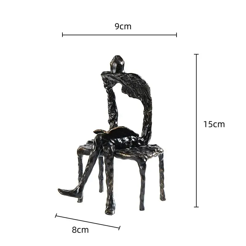 Black textured metal handicraft figure of a gymnast seated on an abstract chair for living room decorbites gymnast metal