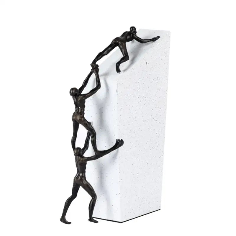 Bronze-colored decorbites gymnast metal handicraft figure showing three stylized figures in chain-link pose on white base