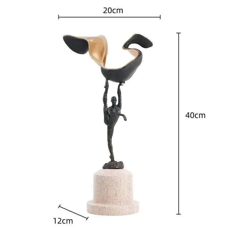 A sleek black and gold metal handicraft figure of a gymnast balancing on one leg for living room decorbites gymnast metal decor